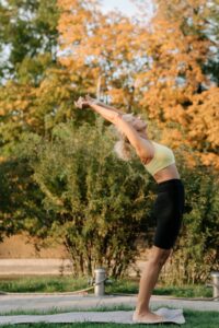 woman stretching in the fall.